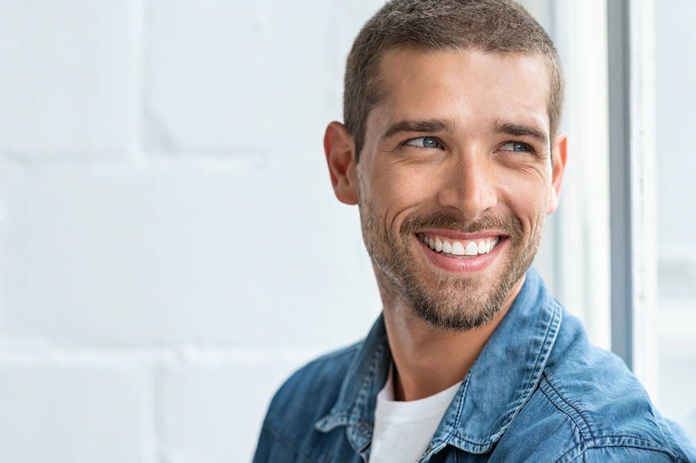Smiling man showing off his healthy teeth